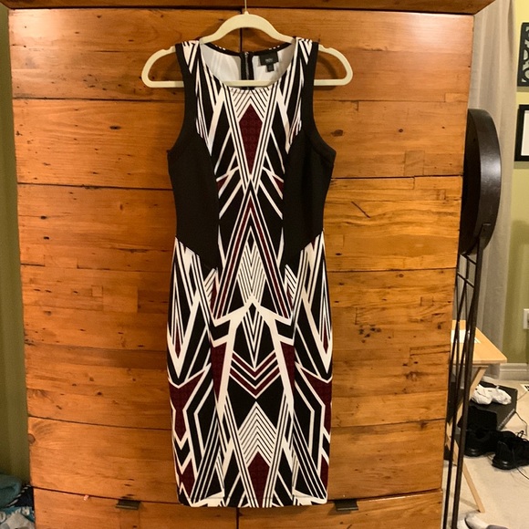 Super nice form fitting dress. Zip back. Polyester/Spandex blend. - Picture 1 of 3